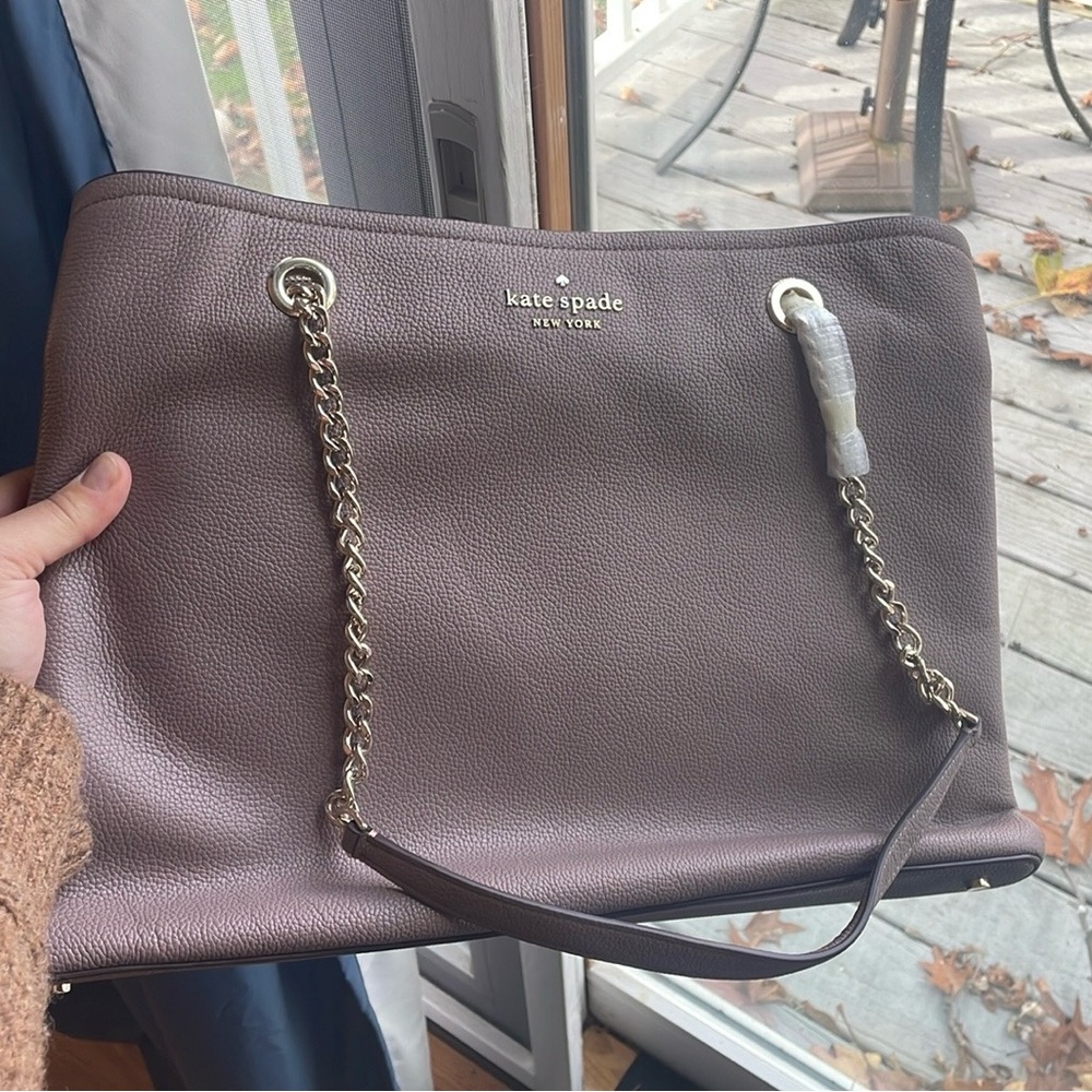 Kate Spade, never used!! New bag, with silver chain hardware. Inside pockets
